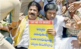  ??  ?? Police officials arrest Telangana TDP working President A. Revanth Reddy and other TDP activists who took part in the rally against drug menace at Ambedkar Statue near Tank Band in Hyderabad on Monday. — DC