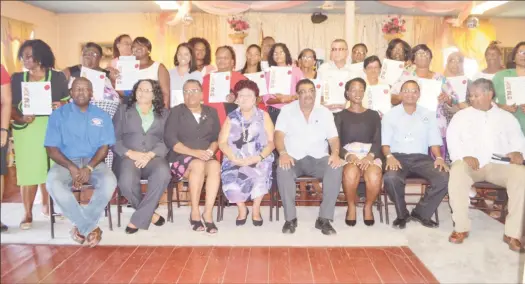  ??  ?? Minister of Social Protection Amna Ally (seated fourth from left), regional officials and licensed day care facility representa­tives. (DPI photo)