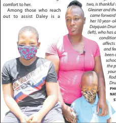  ?? PHOTO BY NATHANIEL
STEWART ?? Olivia Daley, the mother of two, is thankful to The Gleaner and those who came forward to assist her 10 year- old son Dayquan Drummond (left), who has a rare skin condition that affects his palms and feet. He has been out of school. Also in the photo is her younger son, Rodrick Drummond