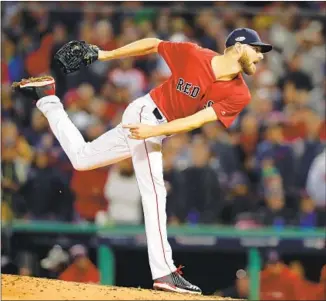  ?? Tim Bradbury Getty Images ?? BOSTON ACE Chris Sale is rejoining the team for Game 3 of the American League Championsh­ip Series against Houston after spending a night in a hospital because of a stomach illness.