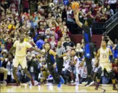  ?? MARK WALLHEISER — THE ASSOCIATED PRESS ?? Duke forward Cam Reddish takes the game-winning shot against Florida State. Reddish hit a 3-pointer with 0.8 seconds left to give the No. 1 Blue Devils an 80-78 victory over the No. 13 Seminoles Saturday in Tallahasse­e, Fla..