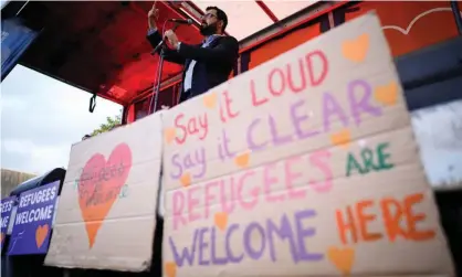  ?? Photograph: Leon Neal/Getty Images ?? Afghan refugee Gulwali Passarlay addresses a rally in Parliament Square in London earlier this week.