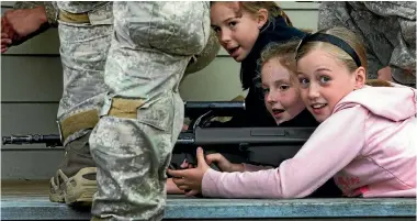  ?? PHOTO: WARWICK SMITH/FAIRFAX NZ ?? Children from Whakarongo School were shown weapons by the army in April.