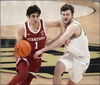  ?? DAVID ZALUBOWSKI — THE ASSOCIATED PRESS ?? Stanford guard Isa Silva and Colorado guard Ethan Wright battle for the ball in the first on Sunday in Boulder.