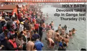  ??  ?? HOLY BATH: Devotees take a dip in Ganga last
Thursday (14)