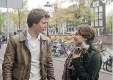  ?? JAMES BRIDGES/20th Century Fox ?? Ansel Elgort, left, and Shailene Woodley star in the film adaptation of The Fault in Our Stars. A young couple in love wisecrack their way
through the terminal cancer tragedy that is their lives.