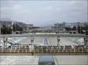  ?? HANS-MAXIMO MUSIELIK — THE ASSOCIATED PRESS ?? Central Americans who travel with a caravan of migrants walk toward the border before crossing the border and request asylum in the United States, in Tijuana, Mexico, Sunday. A group of Central Americans who journeyed in a caravan to the U.S. border...