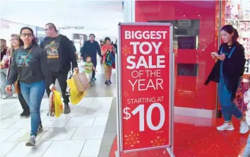  ?? — AFP ?? Photo shows sales attract people to the Westfield Shopping Mall in Arcadia, California.