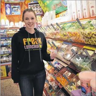  ?? MELISSA WONG/SPECIAL TO THE TELEGRAM ?? Julie Learning, a cashier at Freak Lunchbox in downtown St. John’s, is always happy to scoop bulk candy into a reusable container.