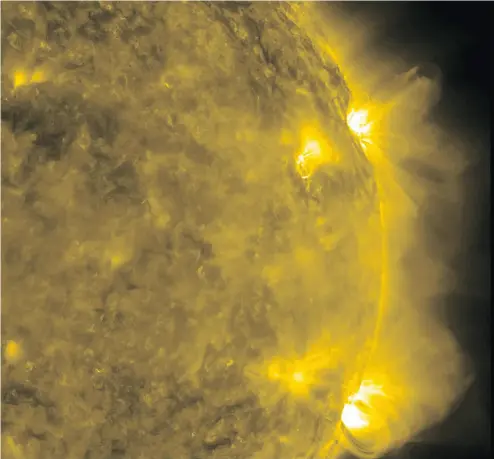  ?? NASA / AFP / GETTY IMAGES ?? A pair of active regions on the Sun put on quite a show over a three- day period (Feb. 7-10, 2011). A solar flare is one of the vulnerabil­ities of our technology-reliant society, writes professor Peter Townsend.