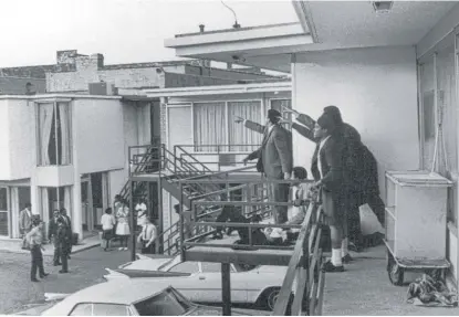  ?? JOSEPH LOUW/ TIME & LIFE PICTURES/ GETTY IMAGES ( ABOVE); BRENDAN SMIALOWSKI/ AFP/ GETTY IMAGES ( RIGHT) ?? ABOVE: Associates of the Rev. Martin Luther King Jr. and others on the balcony of the Lorraine Motel point in the direction of gunshots after the assassinat­ion of King, who is lying at their feet. RIGHT: The Rev. Jesse Jackson visits the balcony...