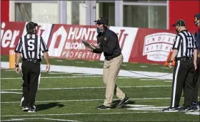  ?? DOUG MCSCHOOLER — THE ASSOCIATED PRESS ?? Michigan head coach Jim Harbaugh reacts towards a game official after a call during the second half of an NCAA college football game against Indiana, Saturday, Nov. 7, 2020, in Bloomingto­n, Ind. Indiana won 38-21.