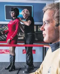  ?? NICK AGRO/THE ASSOCIATED PRESS ?? Steve Greenthal adjusts the wax head of Star Trek character Uhura on its body next to a figure of Captain Kirk at the Fullerton Airport in Fullerton, Calif.