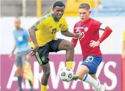  ?? CONCACAF. COM PHOTO ?? Malachi Douglas of Jamaica drives the ball forward during the 2022 Concacaf Under-20 Championsh­ip match against Costa Rica at the Francisco Morazán stadium in San Pedro Sula, Honduras last Saturday. The game ended in a 1-1 draw.