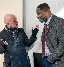  ??  ?? Neil Cross and Elba have ‘‘joint custody’’ over Luther.
