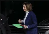  ?? JEFF CHIU — THE ASSOCIATED PRESS ?? House Speaker Nancy Pelosi is escorted to a vehicle outside of her home in San Francisco on Friday.