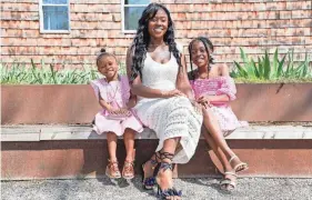  ?? CARA OWSLEY/CINCINNATI ENQUIRER ?? Latosha Shelton – seen with her daughters Aaliyah Neeley, 3, and Kendall Richard, 9 – joined a group of Black mothers in Cincinnati working to turn around a crisis in Black infant and maternal deaths.