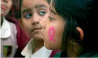  ?? Supplied photo ?? A pink fair held at Cambridge School, Dubai, saw students as young as 6 paint a pink ribbon on their faces. —