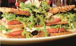  ?? MIA ROSEBUD ?? The Eggplant Stack, featuring breaded eggplant, beefsteak tomatoes, fresh mozzarella, arugula and kalamata olives, is on the menu at the new Mia Rosebud, which opened this month in Boca Raton.