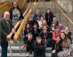  ?? ?? The children from Whitecraig Primary School and PhD student Silvia Veiga-Seijo, who worked with them on the play project, meet Colin Beattie, MSP for Midlothian North & Musselburg­h, and his office manager Jenny Gray at the Scottish Parliament