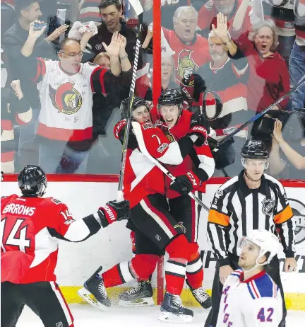  ?? FRED CHARTRAND/THE CANADIAN PRESS ?? Ryan Dzingel celebrates his power-play goal with teammates Kyle Turris and Alex Burrows in Game 1 in Ottawa on Thursday. The Sens’ power play has been a mystery, operating at 14.5 per cent at home, 27th in the league, but 19.4 per cent on the road,...