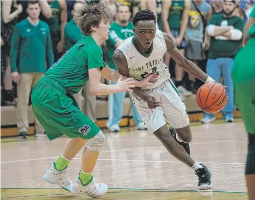  ?? WORSOM ROBINSON/FOR THE SUN-TIMES ?? St. Patrick guard Austin Freeman had 15 points, a game-high nine rebounds, four assists, three steals and hit two key free throws Friday.