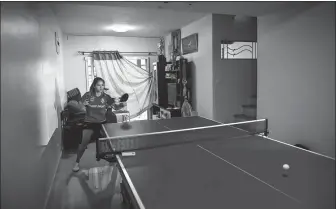  ?? AFP ?? Table tennis player Orawan “Thip” Paranang trains in her living room in Nonthaburi, Thailand on May 29. The makeshift setup is where the 17-year-old, who was born into poverty in rural Thailand, is honing her final preparatio­ns to compete at this summer’s Tokyo Olympics.