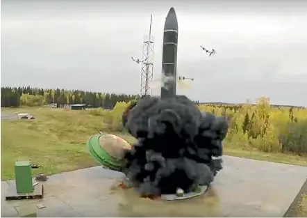  ?? AP ?? An interconti­nental ballistic missile lifts off from a silo somewhere in Russia, in this photo supplied by the Russian Defence Ministry. The Russian military says its new Avangard hypersonic weapon is now operationa­l.