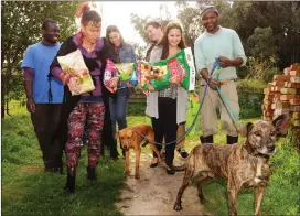  ?? Picture: Tracey Adams/African News Agency (ANA) ?? RELIEF: Shelter employees Bernard Phiri, far left, and Siyanda Gqetywa, far right, welcome Paws For Life representa­tives Merle du Plessis, Merline Haarhoff, Sean Mostert and Natanya du Plessis, who brought donations.