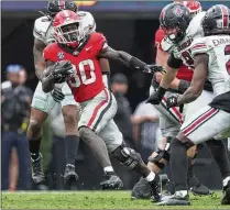  ?? ?? Running back Daijun Edwards missed the season’s first two games, but he came back against South Carolina and rushed for 118 yards and a touchdown on 20 carries.