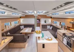  ??  ?? There is room galore in the spacious forward owners cabin (top). In the main saloon, a straight-line galley with an adjacent island (above) is one of two galley configurat­ions.