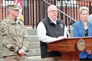  ?? AP Photo/Brian Witte ?? Maryland Gov. Larry Hogan, who chairs the National Governors Associatio­n, announces five priorities that governors are asking of the federal government to fight the coronaviru­s during a news conference Thursday in Annapolis, Md. Maj. Gen. Timothy Gowen, the adjutant general of the Maryland National Guard, is standing left. Karen Salmon, Maryland’s superinten­dent of schools, is standing right.