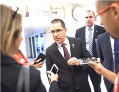  ??  ?? Arreaza (centre) speaks to journalist­s after delivering his speech during the 39th session of the United Nations Human Rights Council in Geneva. — AFP photo