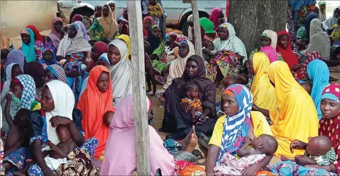  ??  ?? Cross section of mothers waiting to receive RUTF at Mani CMAM site
