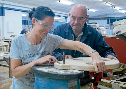  ?? DEB HOPKINS ?? Rexine Hawes is carefully supervised while she takes on a project at the Matamata Men’s Shed