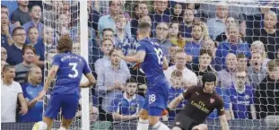  ??  ?? From left: Chelsea’s Marcos Alonso (left) scores his side’s third goal past Arsenal goalkeeper Petr Cech (right) during their English Premier League match at the Stamford bridge in London on Saturday. Tottenham Hotspur’s Harry Kane celebrates after scoring against Fulham during their match at London’s Wembley Stadium on Saturday.