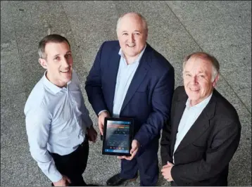  ??  ?? Neil Ryan, InterTrade­Ireland’s Co-Innovate Director, pictured with Tapa Healthcare’s CEO Peter Donnelly (centre) and co-founder Dr John Kellett.