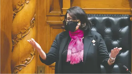  ?? JONATHAN HAywARD/ THE CANADIAN PRESS ?? Lt.-Gov. Janet Austin wears a mask while preparing to deliver the throne speech, which urged “listening to the experts, supporting health care workers on the front lines, and taking care of each other.”