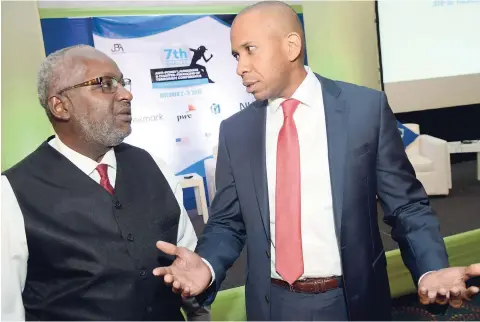  ?? Rudolph Brown/ Photograph­er ?? President of Jamaica Bankers Associatio­n David Noel (rights) converses with Consultant with the Securities Commission of the Bahamas Samuel Wilkinson, at the 7th Annual Anti-Money Laundering/Counter-Financing of Terrorism Conference on the opening day of the two-day event held at Jamaica Pegasus Hotel in New Kingston on Tuesday, October 2, 2018.