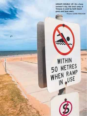  ?? Picture: GLENN FERGUSON ?? UNSAFE DOUBLE UP: On a busy summer’s day, this boat ramp at Torquay is used by both beach goers and boat users.