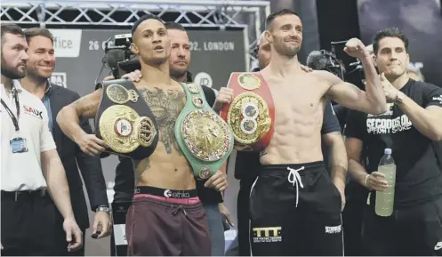  ??  ?? 0
Regis Prograis, left, and Josh Taylor show off their respective world title belts during yesterday’s weigh-in at Canary Wharf, London.