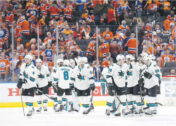  ?? — GETTY IMAGES ?? The San Jose Sharks celebrate a 3-2 overtime victory against the Oilers at Rogers Place in Edmonton on Wednesday night. The Oilers were outshot 44-19.