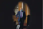  ?? ANDREW HARNIK — THE ASSOCIATED PRESS ?? On Sept. 16, Centers for Disease Control and Prevention Director Dr. Robert Redfield is seen through a door window as he appears at a Senate Appropriat­ions subcommitt­ee hearing on Capitol Hill in Washington.