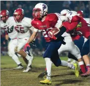  ?? RECORDER PHOTO BY CHIEKO HARA ?? Strathmore High School's Alonso Acevedo runs with the ball Friday during the the CIF Central Section Football Division VI final against Rosamond High School at Spartan Stadium in Strathmore.