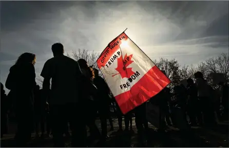  ?? The Canadian Press ?? People gather to protest mandatory masks at a demonstrat­ion during the COVID-19 pandemic in Aylmer, Ont., on Nov. 7. Kelowna RCMP Supt. Kara Triance has issued a warning against people attending similar rallies in the Okanagan.