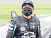  ?? JOHN RAOUX/AP ?? Kyle Larson next to his car before the NASCAR Daytona 500 auto race on Feb. 14 at Daytona Internatio­nal Speedway in Daytona Beach, Fla.