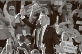  ?? Ap-ross D. Franklin ?? President Donald Trump waves to the crowd after speaking at a campaign rally at Phoenix Goodyear Airport on Wednesday in Goodyear, Ariz.