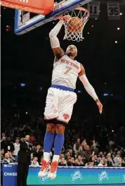  ?? Kathy Kmonicek/Associated Press ?? New York Knicks’ Carmelo Anthony dunks a basket against the Minnesota Timberwolv­es ina 2012 NBA game in New York.