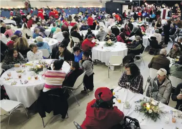  ??  ?? Diners feasted at the 25th Annual Christmas Spirit Community Dinner at Glad Tidings Pentecosta­l Church in 2015. Milton Friesen writes that religious congregati­ons benefit their communitie­s in many ways.