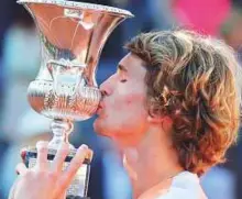  ?? AFP ?? Alexander Zverev of Germany kisses the trophy after winning the Italian Open against Novak Djokovic of Serbia at the Foro Italico in Rome on Sunday.